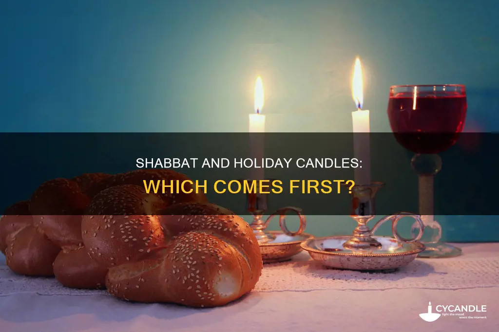 are shabbat candles lit before hoiday candles on friday evening
