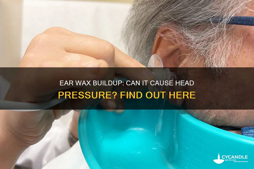 can ear wax build up cause pressure in head