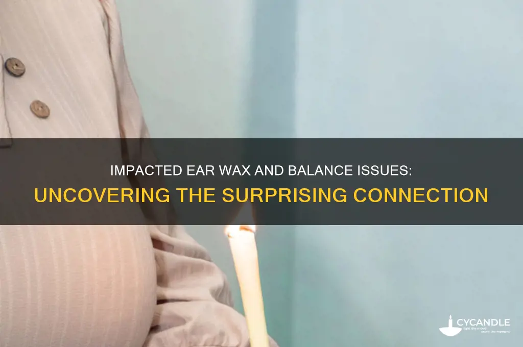 can impacted ear wax cause balance problems