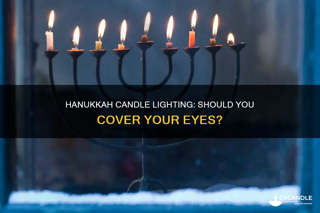 do you cover your eyes when lighting hanukkah candles