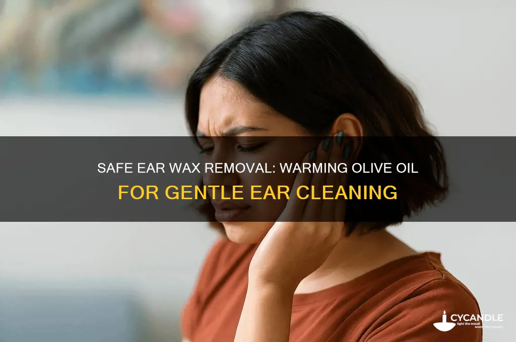 how warm olive oil to remove ear wax