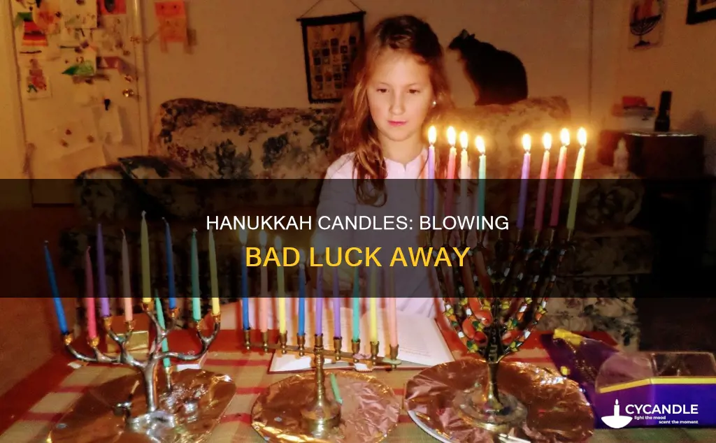 is it bad luck to blow out hanukkah candles