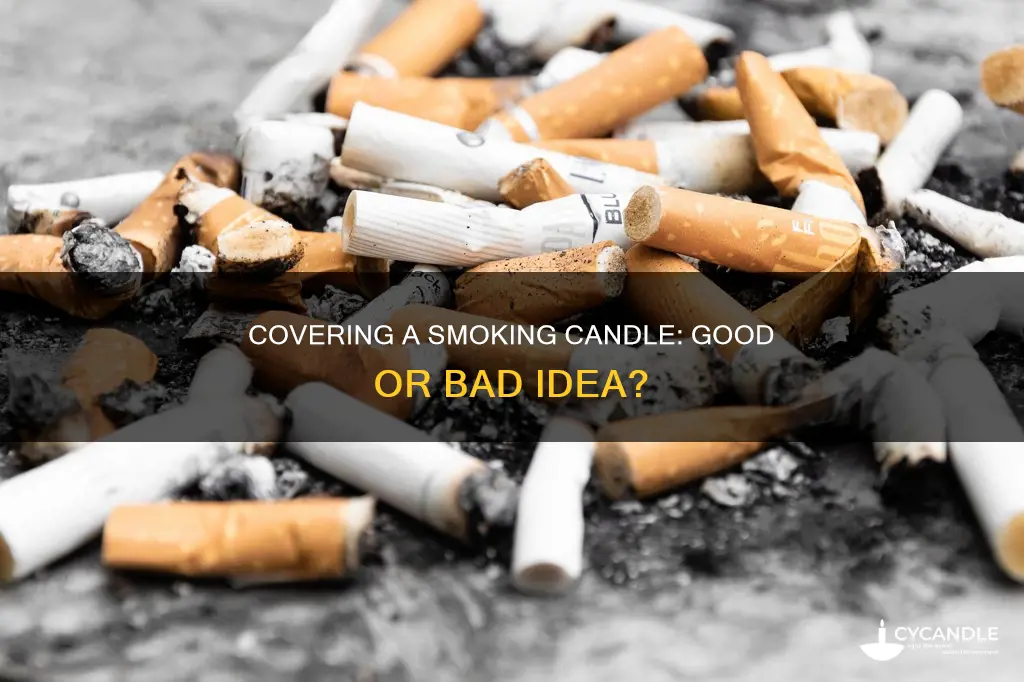 is it bad to cover candle while its smoking