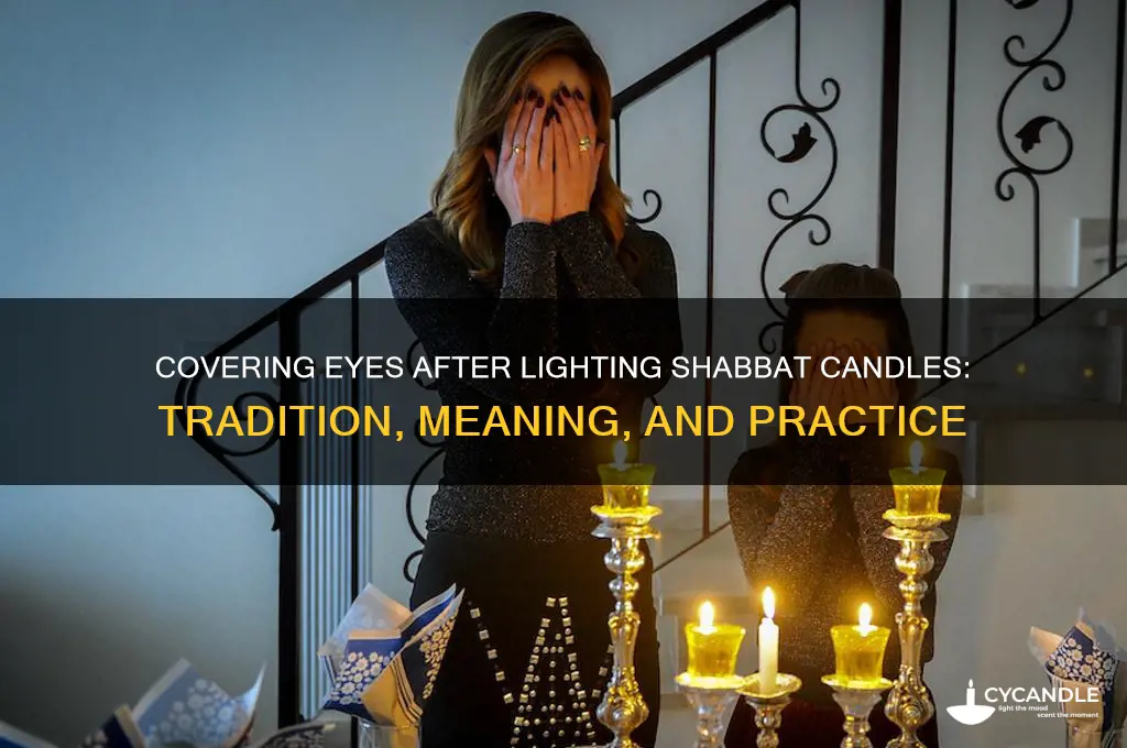 should i cover my eyes after lighting shabbat candles