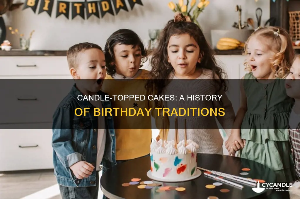 when did adding candles to a cake originate
