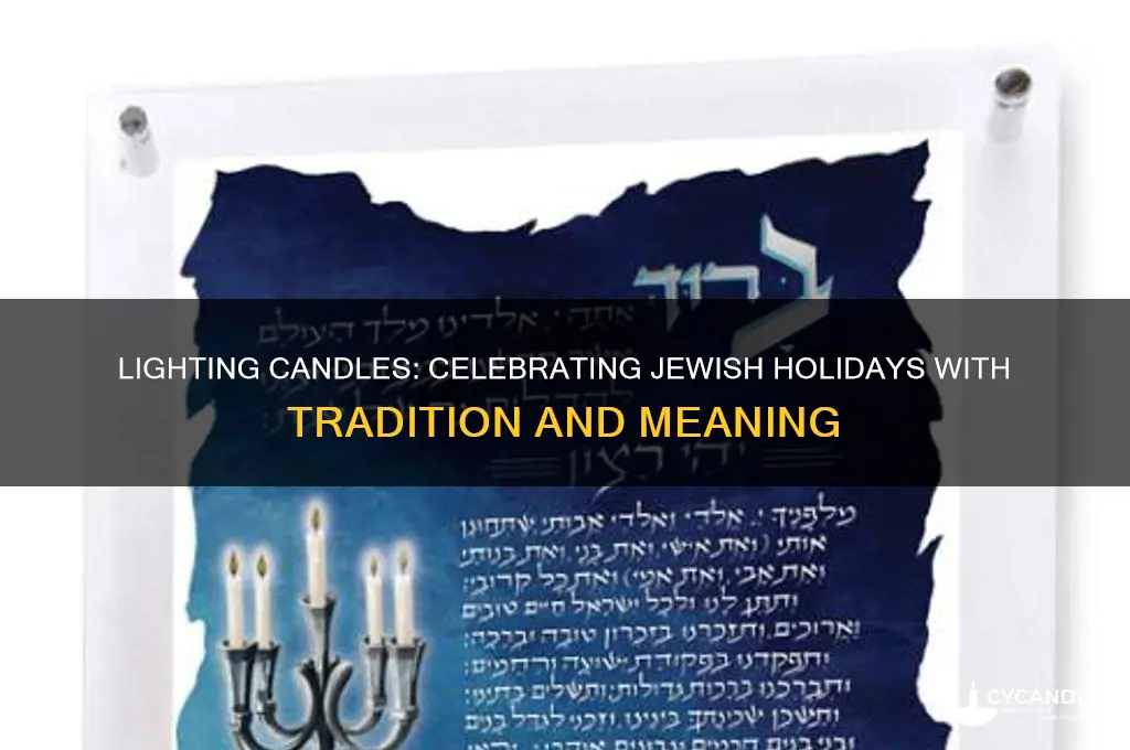 which jewish holiday lighting candles