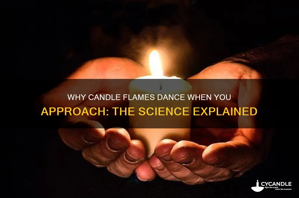 why do candle flams move when you get near them