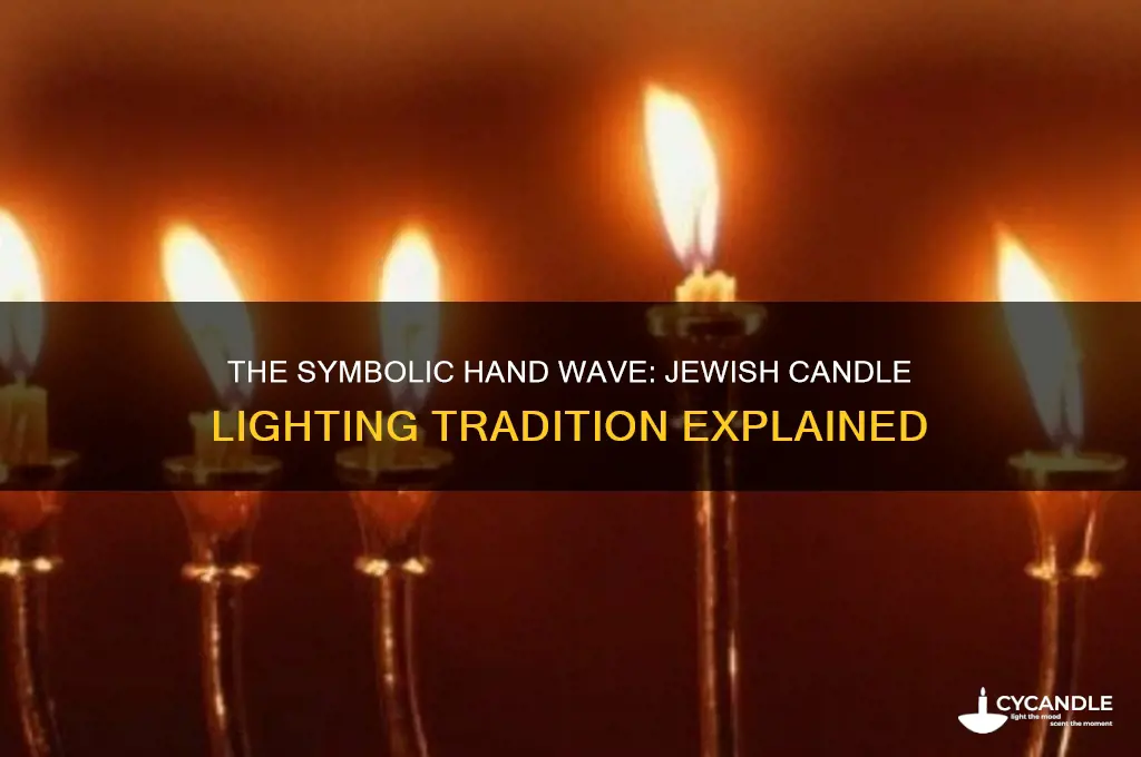 why do jews wave their hands when lighting candles