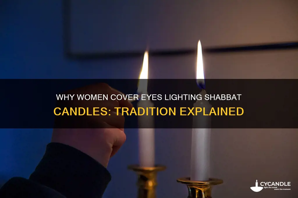 why do women cover their eyes when lighting shabbat candles